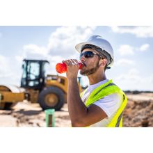 Construction worker drinking Sqwincher